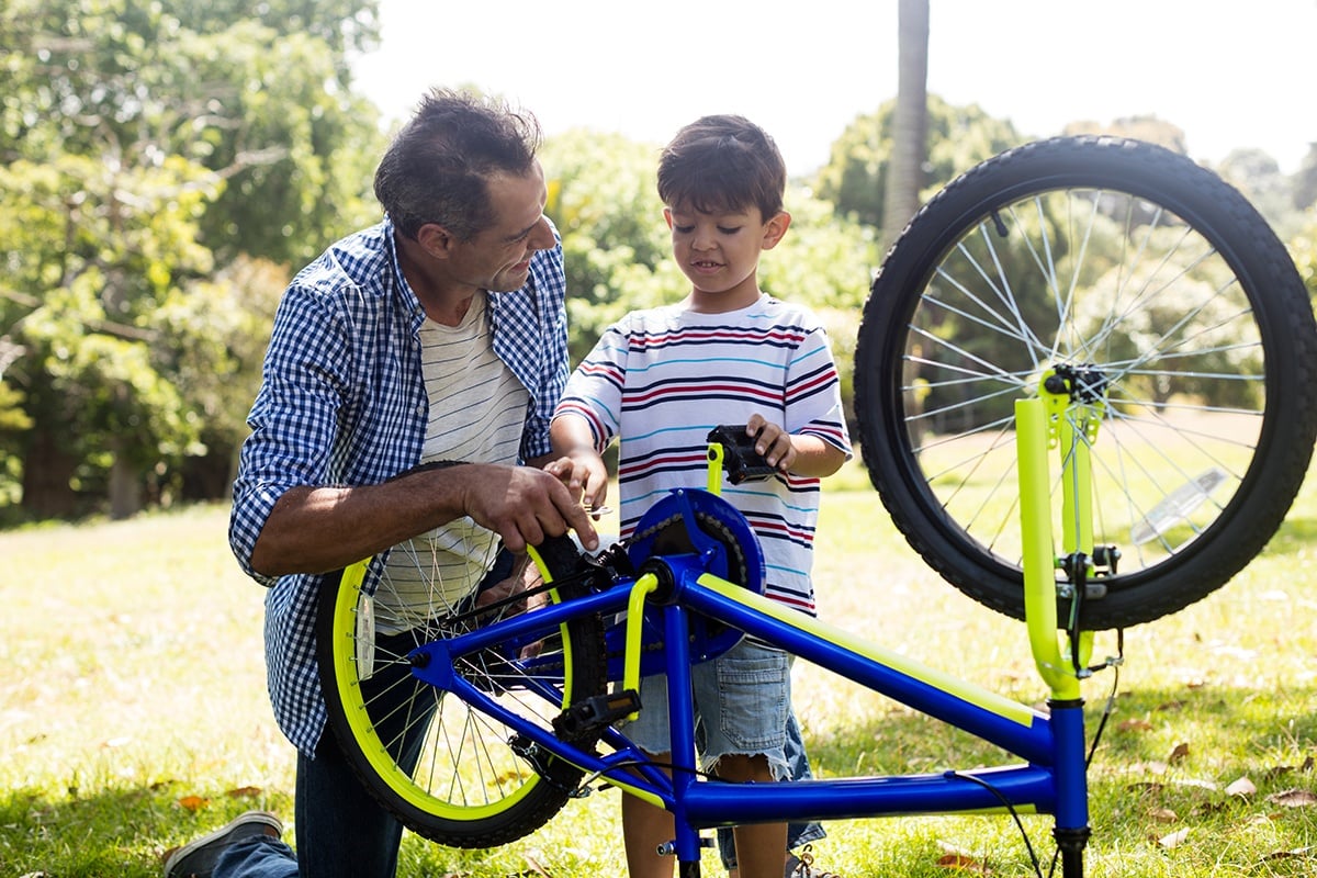 Father and son fixing bike 4